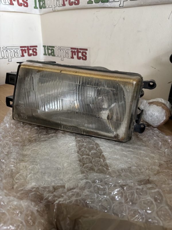 Headlight - Carello 03290748 - Alfa Romeo 75 **used part**